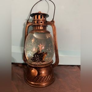 Battery operated light up snow globe lantern with bears and trees.